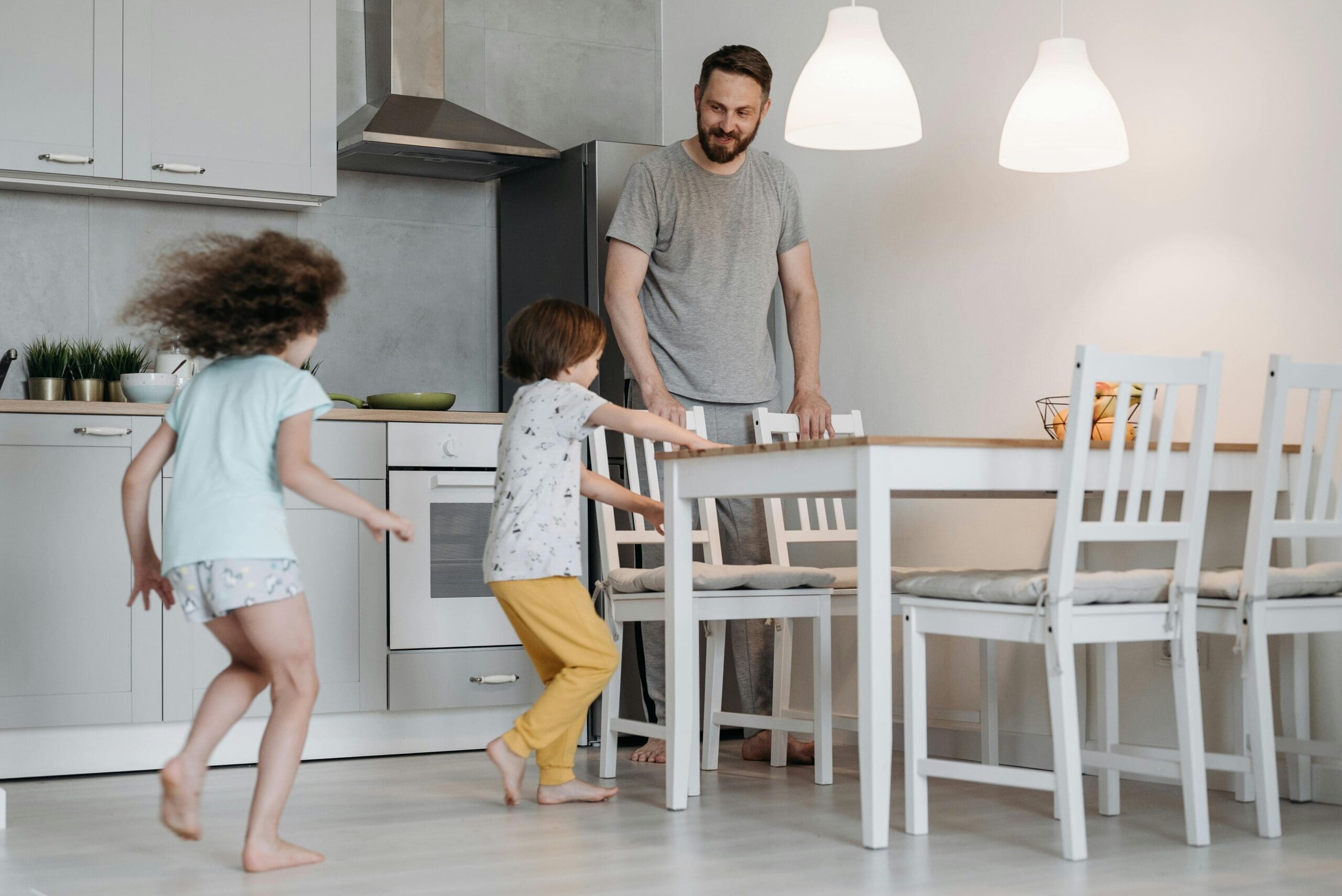 Family spending time together in a sustainable kitchen.